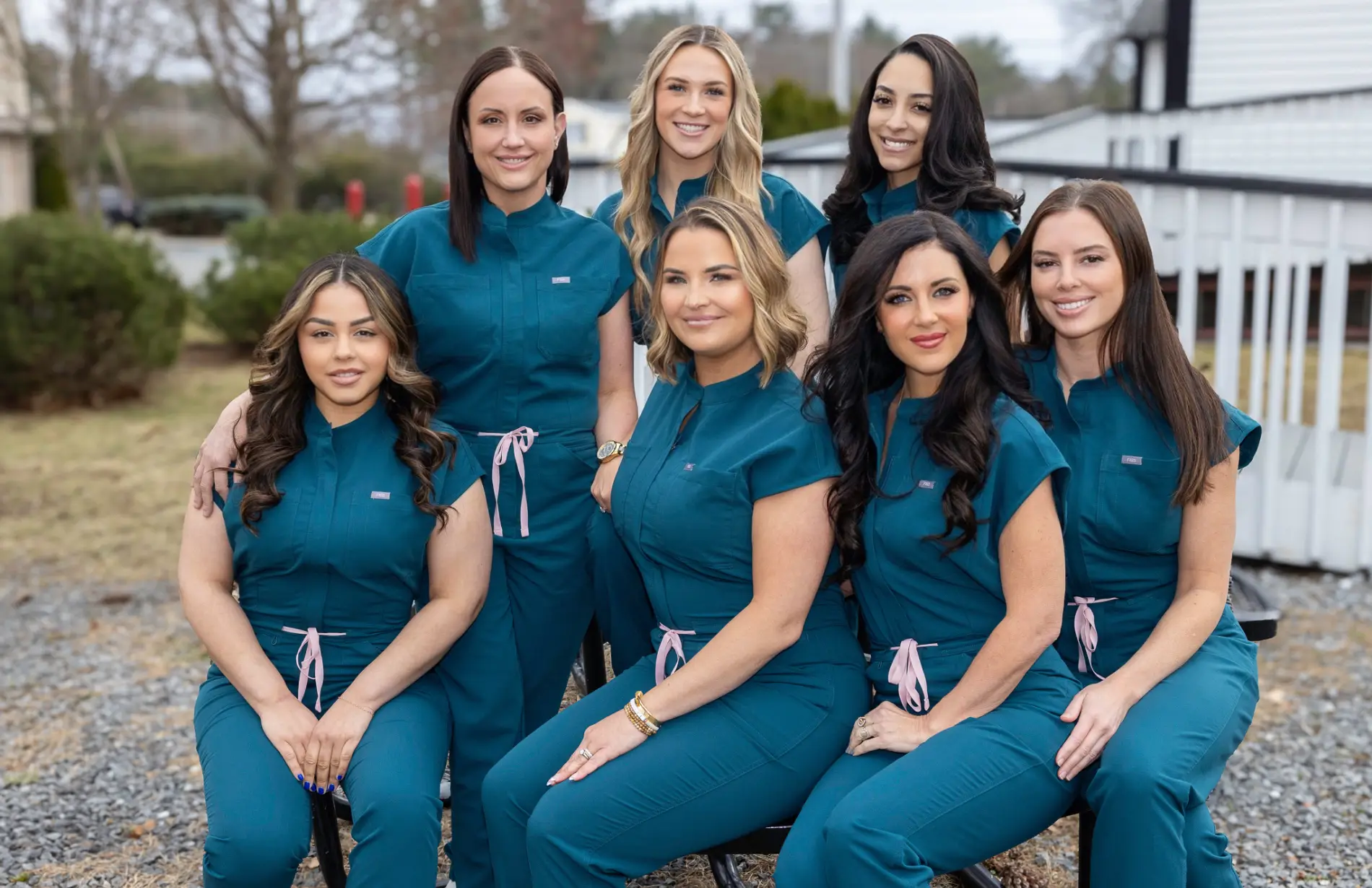 a group of women wearing blue uniforms