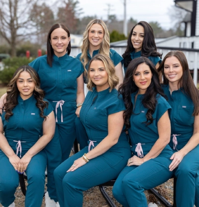 a group of women wearing blue uniforms