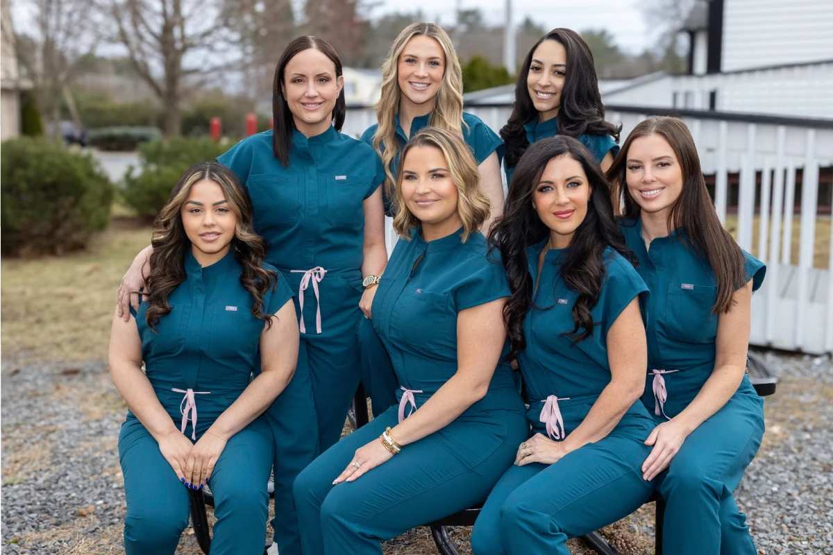 a group of women wearing blue uniforms