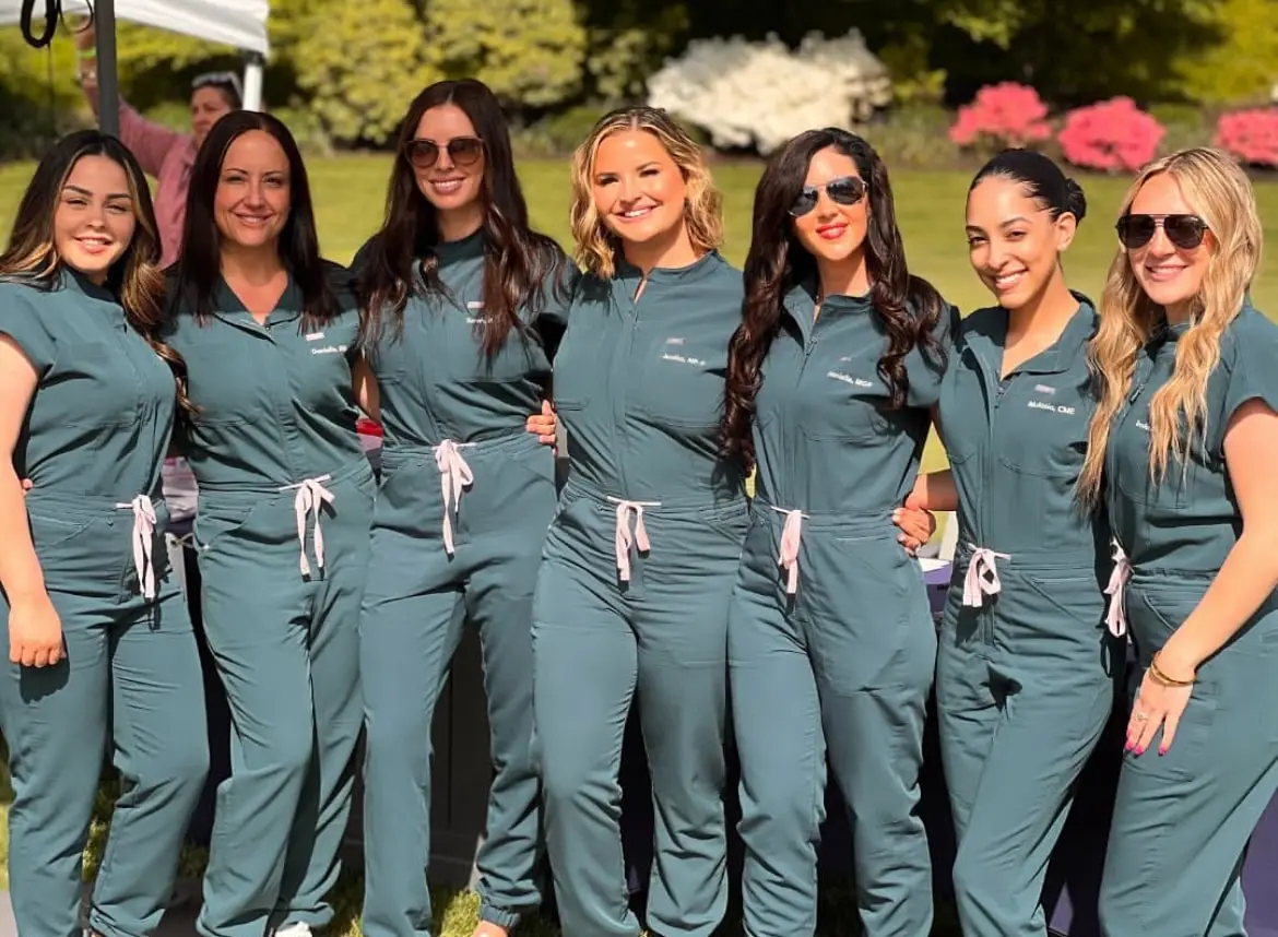 a group of women wearing matching outfits