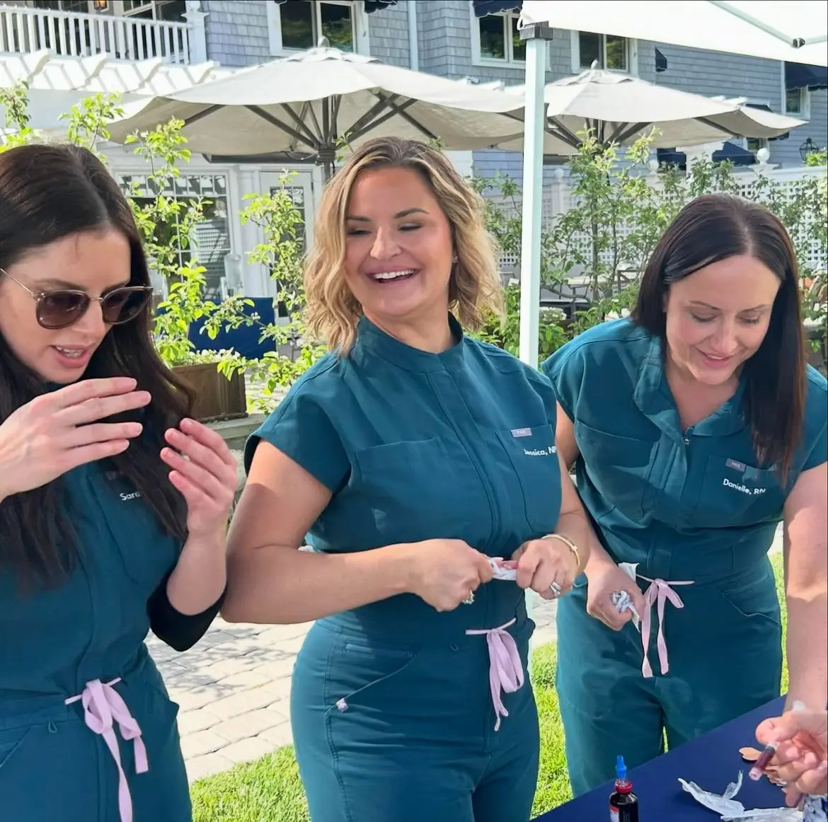 a group of women wearing matching outfits