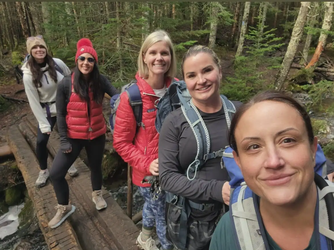 a group of women on a bridge