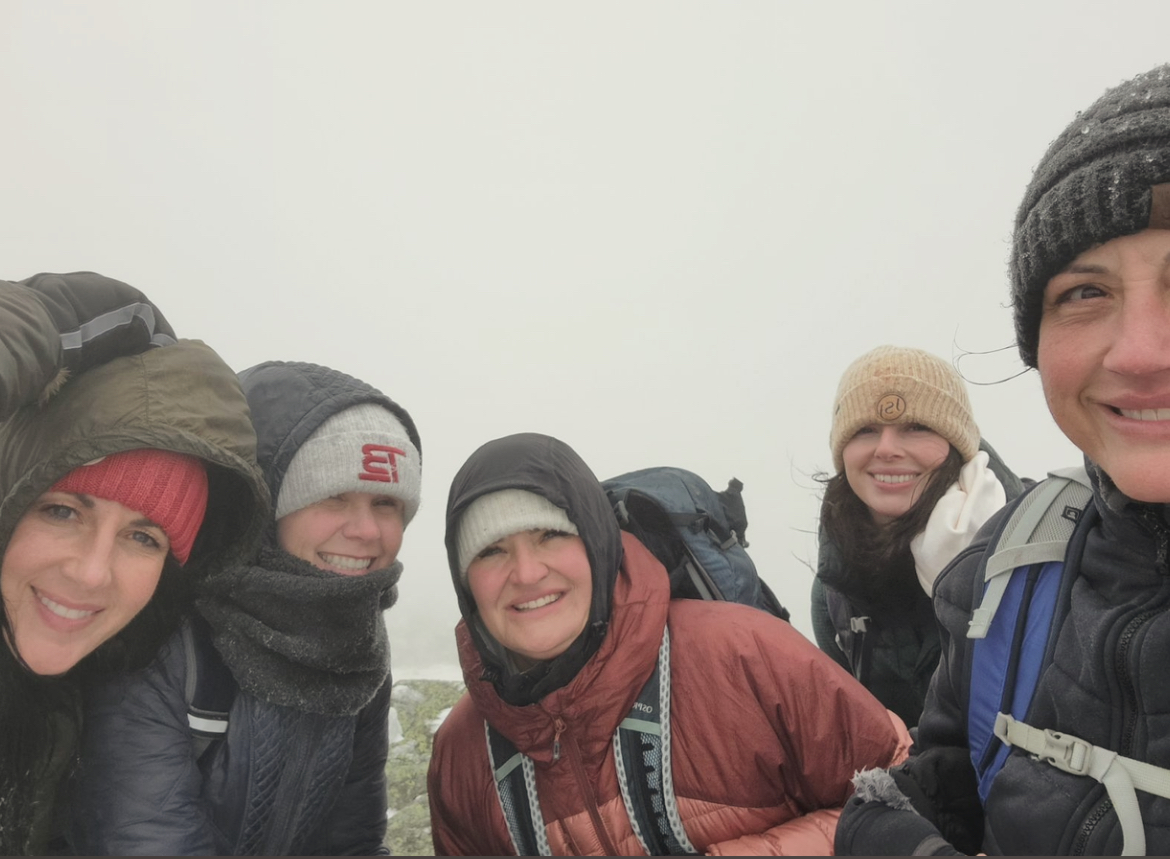 a group of people posing for a photo