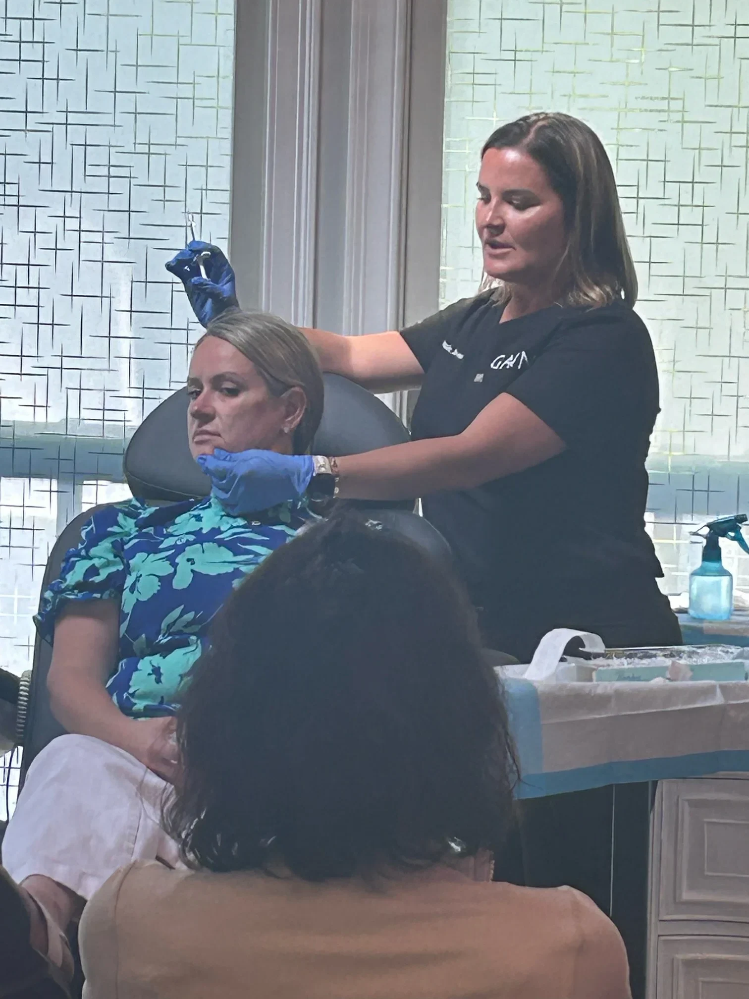 a woman getting a facial injection