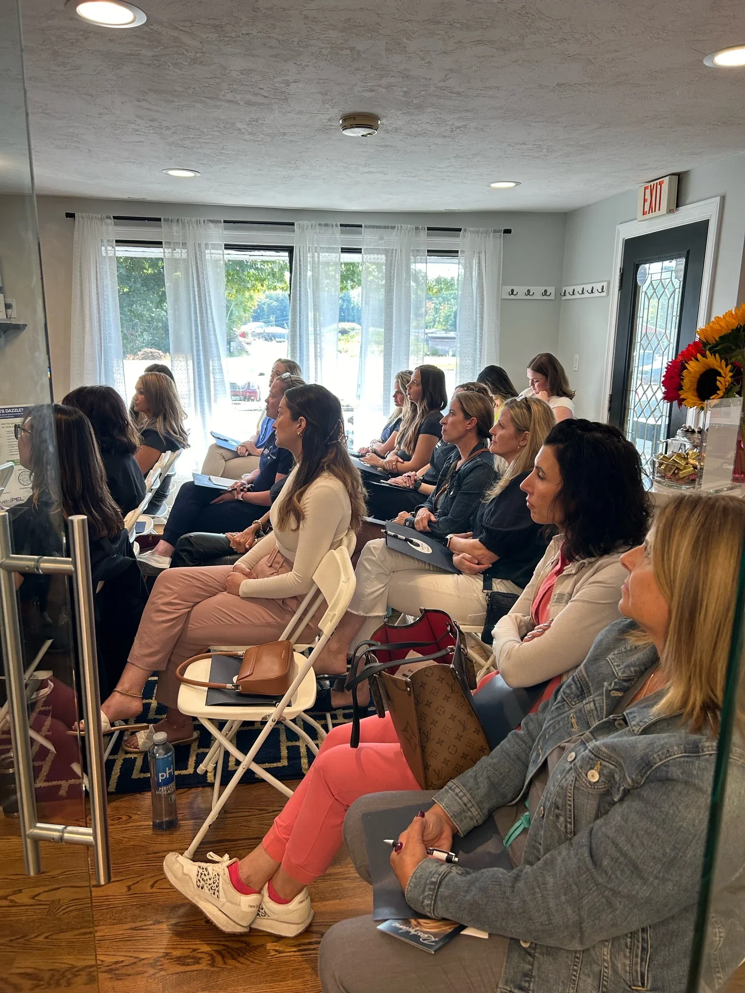 a group of women sitting in chairs