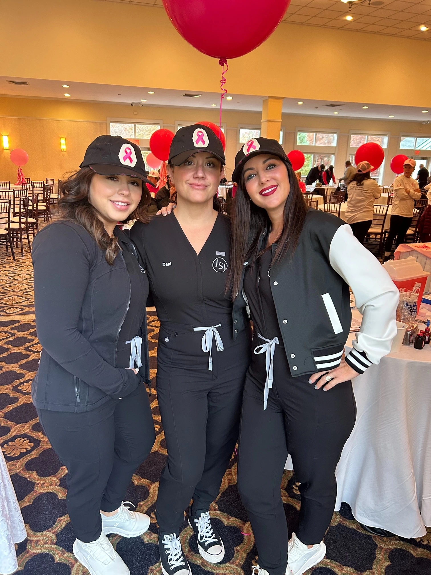 a group of women wearing matching outfits