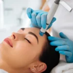 A woman receiving a HydraFacial treatment in Salem, NH