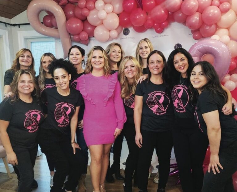 a group of women posing for a photo