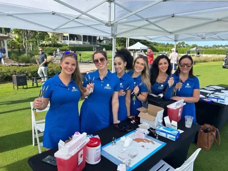 a group of women wearing blue shirts