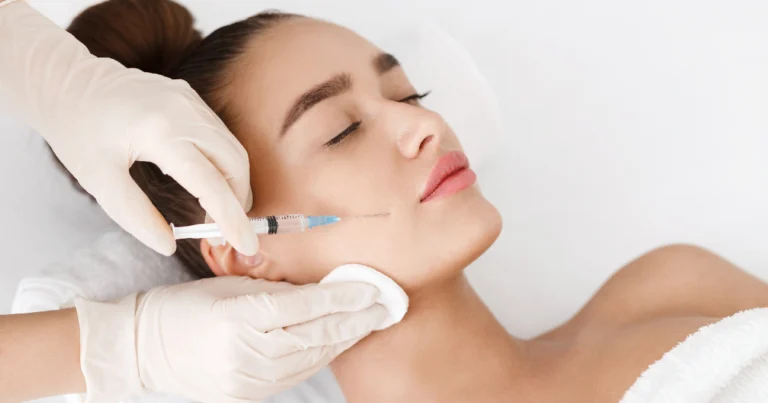Woman receiving a Botox injection treatment in Salem, NH in her cheek from a medical professional