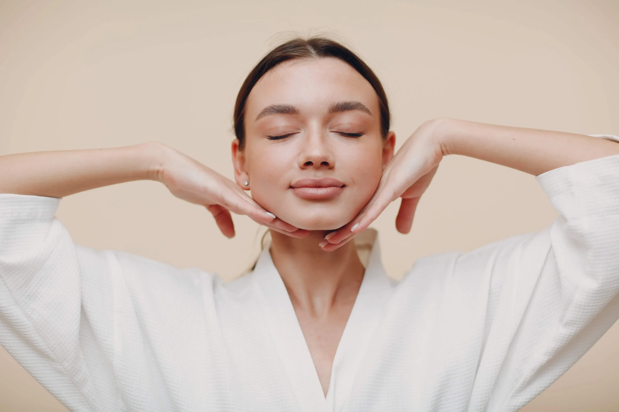A woman takes facial treatment